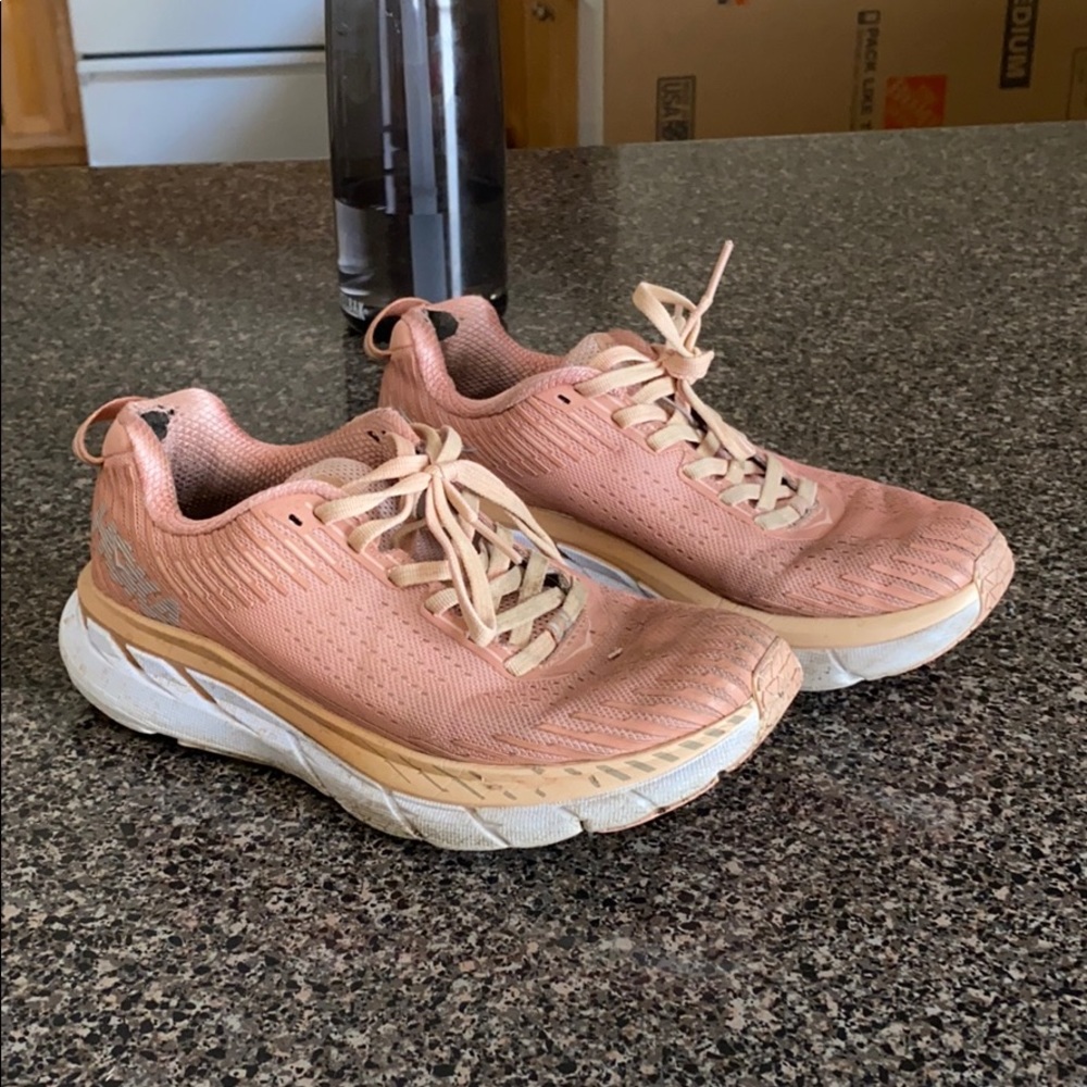 Pink HOKA sneakers